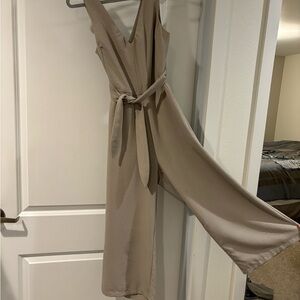 Taupe crop leg jumpsuit withh open back and tie